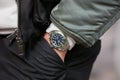 Man with green Rolex Submariner watch before Cristiano Burani fashion show, Milan Fashion Week street style Royalty Free Stock Photo