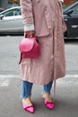Woman with pink trench coat, bag and shoes before fashion Albino Teodoro show, Milan Fashion Week street