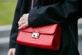 Woman with red crocodile leather bag before Emporio Armani fashion show, Milan Fashion Week street style on