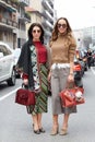 Women pose for photographers with Fendi and Gucci bags before Etro and Iceberg fashion show, Milan Fashion Royalty Free Stock Photo