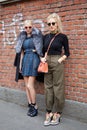 Women poses for photographers with Fendi shoes before Fendi fashion show, Milan Fashion Week Day 2 street Royalty Free Stock Photo