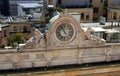 Milan, Italy - April 21, 2012: The clock with sculptures on facade of building seen from Duomo's rooftop.