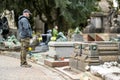 MILAN, ITALY - APRIL 2022: Male tourist admiring the impressive sculptures, tombs and monuments of Cimitero Monumentale di Milano