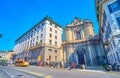 Via Senato street with old Chiesa Cristiana Copta Ortodossa San Marco sandwiched between two buildings, Milan, Italy