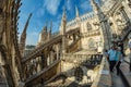 Milan, Italy - Aug 1, 2019: Numerous tourists walk on the observation deck on the roof of Milan Cathedral - Duomo di Milano, Royalty Free Stock Photo