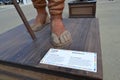 Feet with sandals of the character Norcinello of The Food People statues by Dante Ferretti at the Expo Milano 2015.