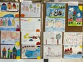 Milan, Italy - 17 august 2023: Exhibition of colorful children drawings on stands