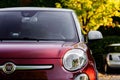 Milan, Italy - August 15, 2022: Fiat 500 classic retro car parked at city street road. Iconic vintage car at city center