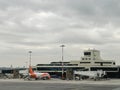 Milan, Italy - 17 august 2023: Passenger plane with covered airstairs stands in front of the airport Royalty Free Stock Photo