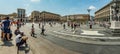 MILAN, ITALY - AUGUST 1, 2019 : Wide angle panorama. The Cathedral Square, looking from main stairs of facade of the Duomo and the Royalty Free Stock Photo