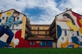 Milan, Italy Colorful wall graffiti under blue sky.