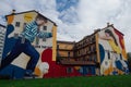 Milan, Italy Colorful wall graffiti under blue sky.