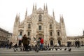 MILAN, ITALY - DECEMBER 14: Tourists feeding birds at Milan