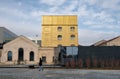 Milan, ITALY FEB 2019 - Fondzione Prada museum - golden yellow warm building in the new square Adriano Olivetti in the south of Royalty Free Stock Photo