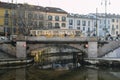 Traditional milanese tram on Naviglio Grande in Milan during winter