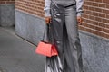 Milan, Italy - February 22, 2023: woman wearing Fendi Peekaboo shoulder bag. Fashion blogger outfit details