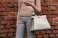 Milan, Italy - February 22, 2023: woman wearing Fendi Peekaboo shoulder bag. Fashion blogger outfit details