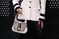 Milan, Italy - February 24, 2023: fashioner wearing shoulder bag from Gucci. Fashion blogger outfit details