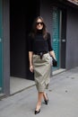 Alex Riviere with black turtleneck and grey skirt before Max Mara fashion show, Milan Fashion