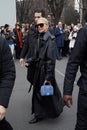 MILAN, ITALY - FEBRUARY 22, 2023: Caro Daur with black leather trench coat before Alberta Ferretti fashion show, Milan Fashion
