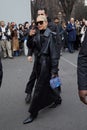 MILAN, ITALY - FEBRUARY 22, 2023: Caro Daur with black leather trench coat before Alberta Ferretti fashion show, Milan Fashion