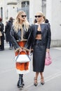 MILAN, ITALY - FEBRUARY 23, 2023: Caro Daur and Xenia Adonts before Prada fashion show, Milan Fashion Week street style