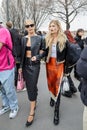 MILAN, ITALY - FEBRUARY 23, 2023: Caro Daur and Xenia Adonts before Prada fashion show, Milan Fashion Week street style