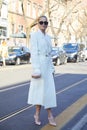 Caroline Daur with white Fendi coat and bag before Fendi fashion show, Milan Fashion Week street
