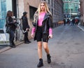 MILAN, Italy: 21 February 2019: Fashion blogger posing in streetstyle outfit Royalty Free Stock Photo