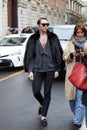 MILAN, ITALY - FEBRUARY 26, 2023: Man with black fur jacket and trousers before Luisa Spagnoli fashion show, Milan Fashion Week