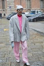 Man with pink trousers, shirt and grey jacket before Blumarine fashion show, Milan Fashion Week Royalty Free Stock Photo