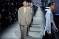 MILAN, ITALY - FEBRUARY 24: Models walk the runway finale at the Tods fashion show during the Milan Fashion Week