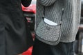 Street style, woman wearing Prada: silver Cleo handbag in detail