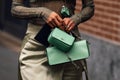 Milan, Italy - February 22, 2023: woman wearing Fendi shoulder bag. Fashion blogger outfit details