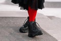 Milan, Italy - February 23, 2023: woman wearing Moncler sneakers. Fashion blogger outfit details