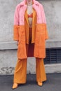 Woman wearing orange outfit: blazer jacket, pants and shoes Royalty Free Stock Photo