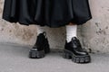 Milan, Italy - February 23, 2023: woman wearing Prada loafers. Fashion blogger outfit details