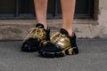 Milan, Italy - February 23, 2023: woman wearing Prada sneakers. Fashion blogger outfit details