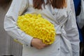 Woman with yellow furry bag and grey shirt before Onitsuka Tiger fashion show, Milan Fashion