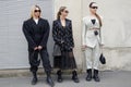 MILAN, ITALY - FEBRUARY 23, 2023: Women with Prada bags before Prada fashion show, Milan Fashion Week street style