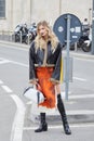 MILAN, ITALY - FEBRUARY 23, 2023: Xenia Adonts before Prada fashion show, Milan Fashion Week street style