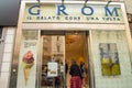 Milan, Italy Gelateria GROM, 05 October 2018 Glass showcase and entrance to the Italian ice cream parlor.