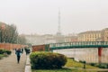 Milan, Italy - January 1, 2018 : foggy winter morning on the Darsena waterfront in Milano city, Alexander Langer Bridge. Tourism