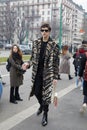 Man with black and beige zebrine coat walking before Gucci fashion show, Milan Fashion Week Royalty Free Stock Photo