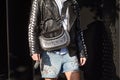 Man with black leather Gucci bag with studs before Gucci fashion show, Milan Fashion Week street