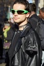 Man with black leather trench coat, Prada mini bag and green Balenciaga sunglasses before Dolce Royalty Free Stock Photo