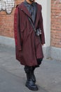 Man with black and red checkered coat and gray shirt before Fendi fashion show, Milan Fashion