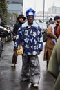 Man with blue jacket with floral design before Magliano fashion show, Milan Fashion Week street