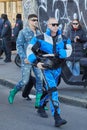 Man with blue, white and black Gucci sport jacket and trousers before Gucci fashion show, Milan