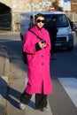 Man with pink coat and black sunglasses before Gucci fashion show, Milan Fashion Week street